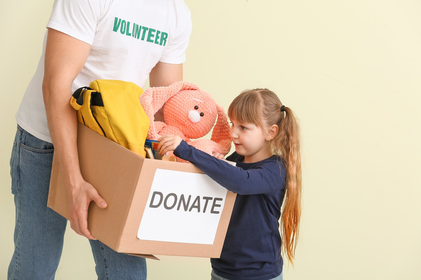 Volunteer with Donations for Orphans and Little Child