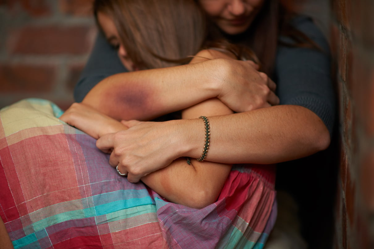 Itll Be Okay.... Abused Woman Embracing Her Frightened Daughter.